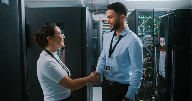 istock Shot of two colleagues working together in a server room 1332104907