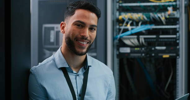 istock Shot of a young male engineer working in a server room 1332104908