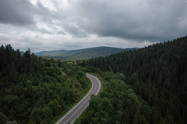 istock Aerial view on mountain road 1332105572