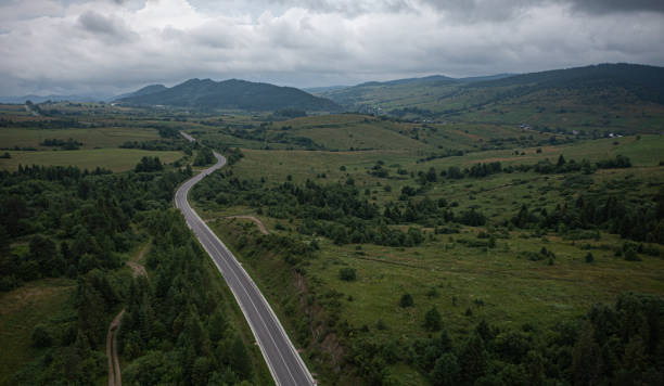 istock Aerial view on mountain road 1332105733