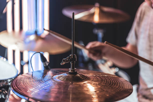 istock Close-up of a drummer playing a drum cymbal on a blurred background. 1332107646