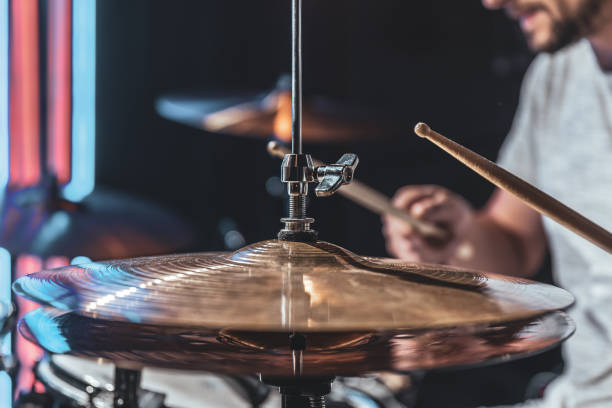 istock A male drummer plays drums with special drum sticks. 1332107648