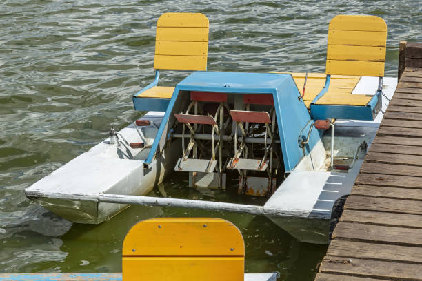 istock An old pedal double catamaran stands at the pier 1332107681