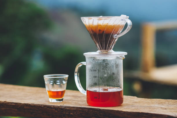 istock Pouring hot water into glass cup with drip,coffee time. 1332107983