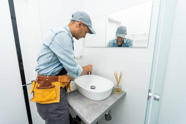 istock plumber installs a new faucet for a sink 1332108529