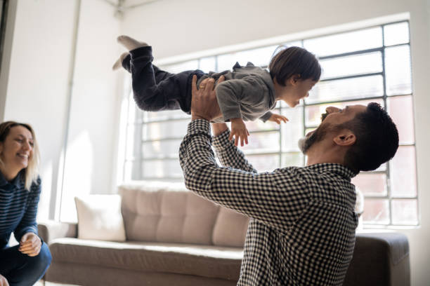 istock Parents playing with baby son with special needs at home 1332111703
