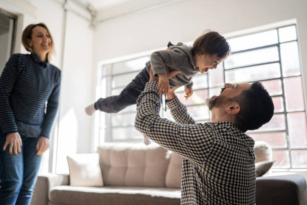 istock Parents playing with baby son with special needs at home 1332111706
