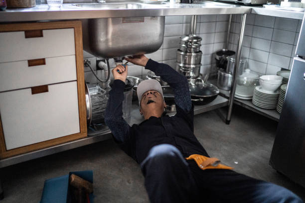 istock Pumber fixing water pipe under the sink 1332113614