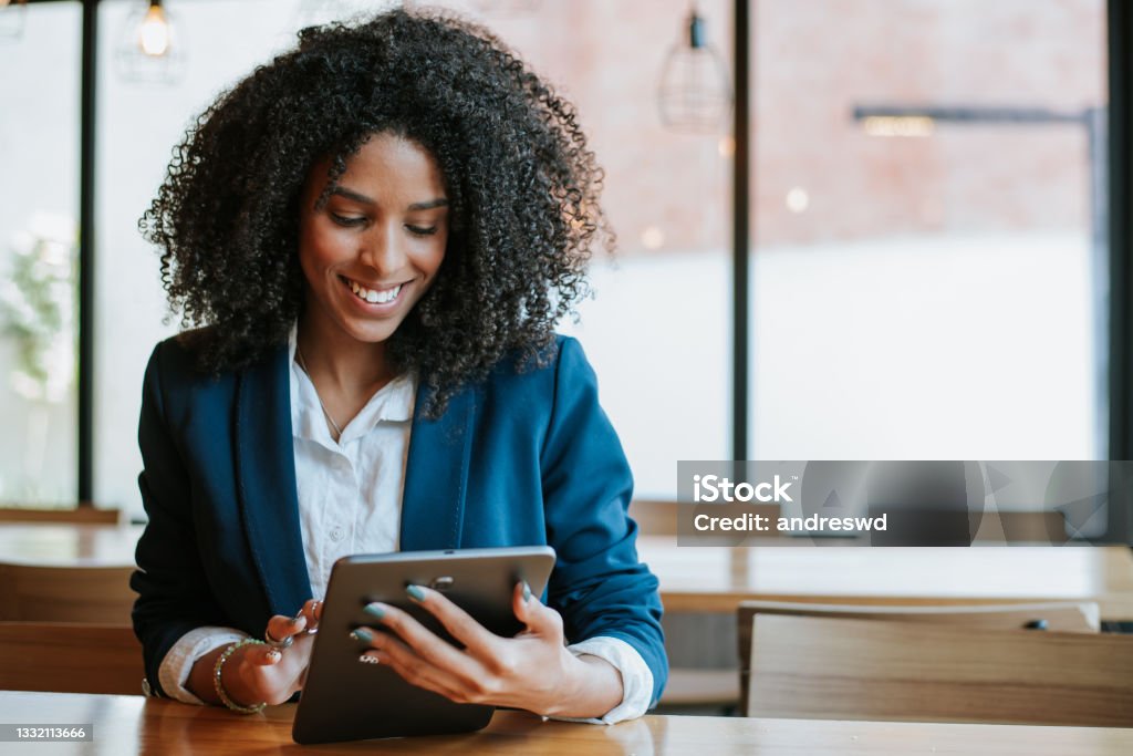 Young businesswoman using digital tablet Women Stock Photo