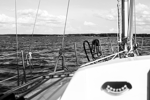 yacht sailing on the lake, view of the water from the yacht, first-person view