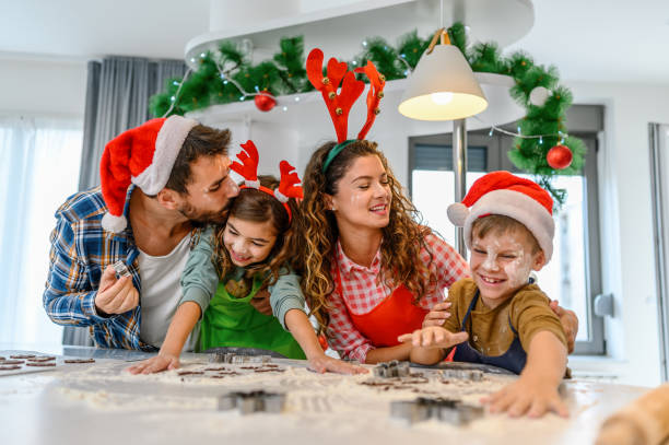 istock Family having fun while making Christmas cookies. 1332118902