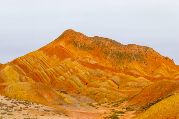 Zhangye Danxia National Geopark Amazing scenery of Rainbow mountain and blue sky background in sunset. Zhangye Danxia National Geopark, Gansu, China. Colorful landscape, rainbow hills, unusual colored rocks, sandstone erosion zhangye danxia geopark china stock pictures, royalty-free photos & images