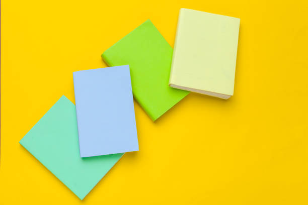 istock Books on a yellow background 1332120244