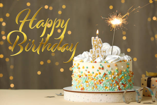 istock Happy Birthday! Beautiful cake with festive decor on white table 1332121587