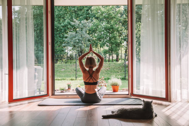 istock Woman practicing yoga at home 1332121820