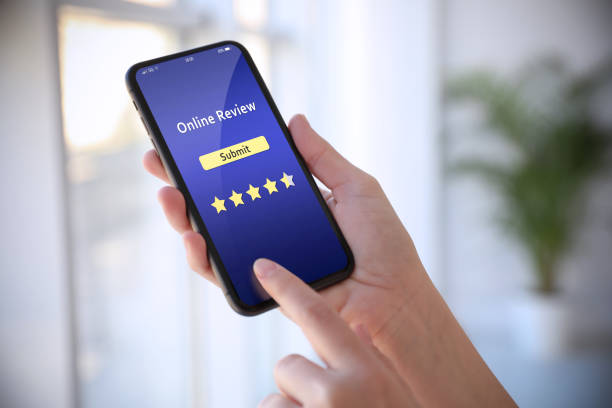 istock Woman using smartphone to give feedback indoors, closeup. Customer review 1332122152