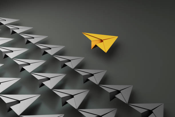 istock paper planes on aline and one leading, isolated on dark background, concept teamwork, leadership and management. 1332125808