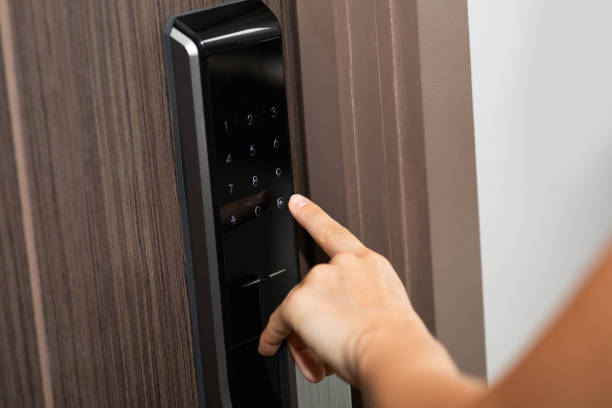 Hand and digital smart code lock into the modern apartment Female hand and digital smart code lock into the modern apartment thai door stock pictures, royalty-free photos & images