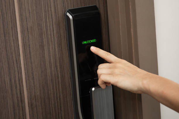 istock Hand and digital smart code lock into the modern apartment 1332127034