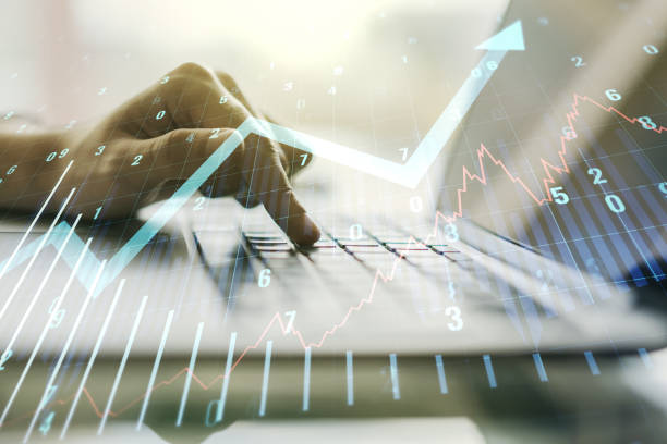 istock Multi exposure of abstract financial graph with upward arrow and hand typing on computer keyboard on background, financial and trading concept 1332127510