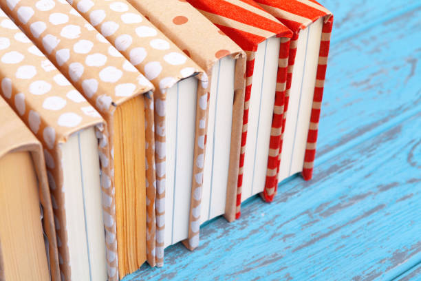 istock books on blue wooden background 1332127610