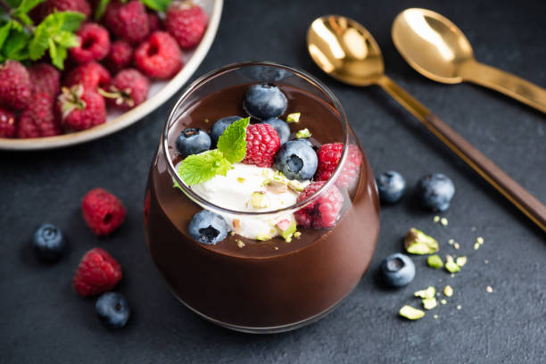 istock Dark chocolate mousse with berries and cream 1332130301