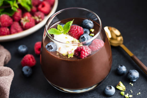 istock Thick Chocolate Mousse With Cream Berries And Pistachios 1332130314