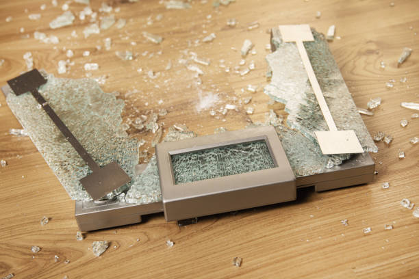 istock Overweight concept. Cracked glass weighing scale 1332130445