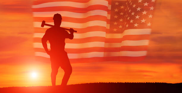 istock Worker on the USA flag background . Labor day holiday concept. 1332134276