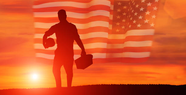 istock Worker on the USA flag background . Labor day holiday concept. 1332134364