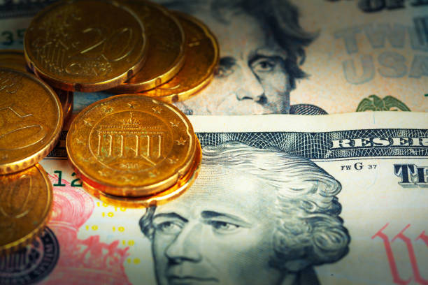 istock US dollar bills and coins 1332136803