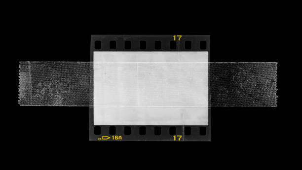 クールな写真のプレースホルダ、35mmフィルムストリップの実際のマクロ写真は、すべての空のフレームウィンドウ全体にテープやセロテープで固定 - スライド ストックフォトと画像