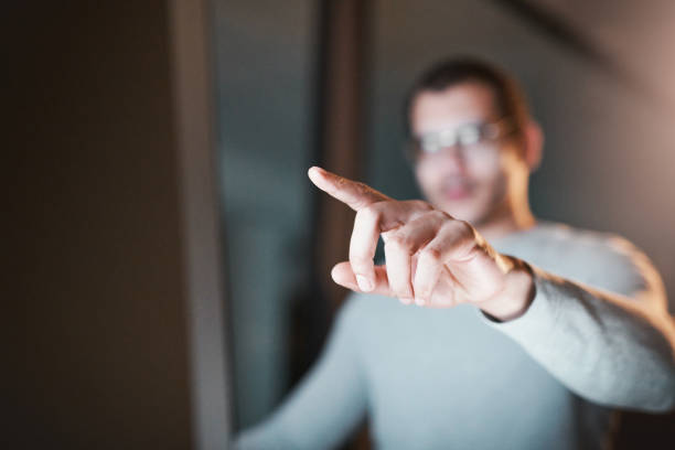 istock Defocused shot of a man pointing to his monitor while using his computer at night at work 1332138842