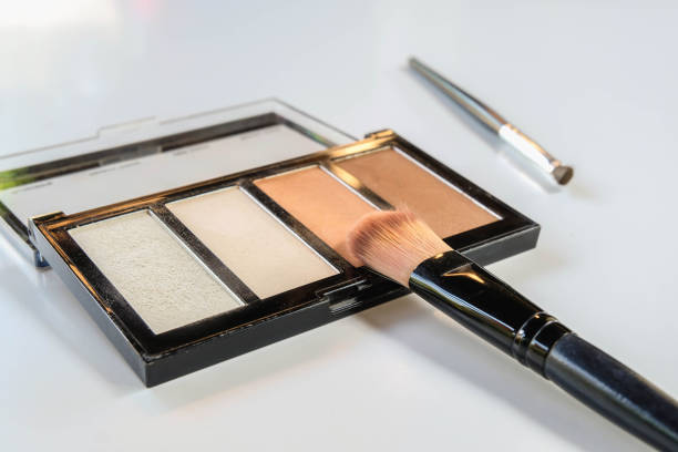 istock Cosmetics with face brush on white background 1332140152