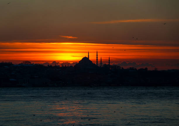 Istanbul - Turkey, Mosque silhouette in sea view at sunset