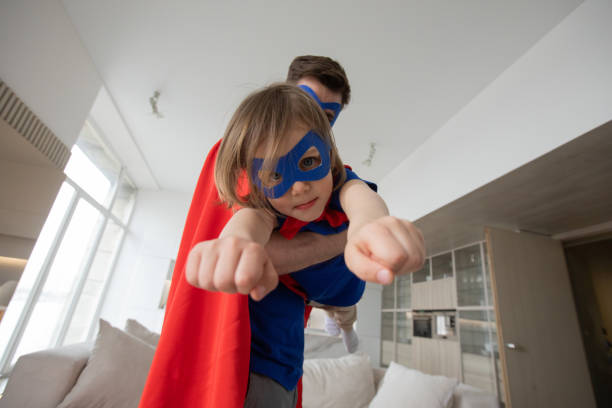 istock Father and son play superhero 1332145244