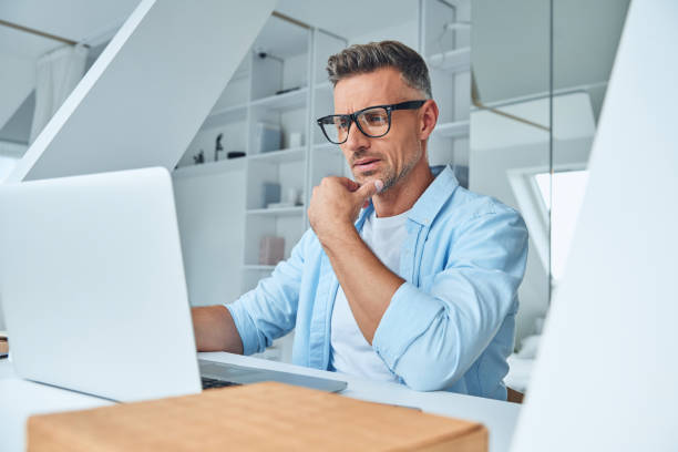 istock Confident mature man working on laptop 1332146114