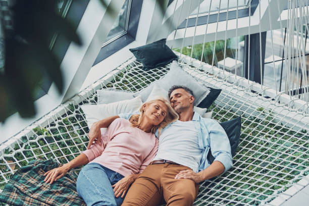 istock Top view of beautiful mature couple sleeping 1332146396