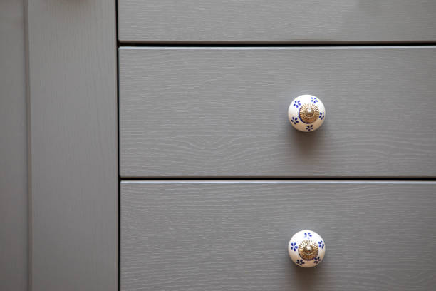Chest of drawers with decorative handles Detail of home decor knob stock pictures, royalty-free photos & images