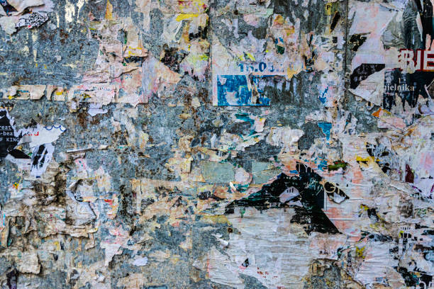 istock Collage of poster scraps pasted on a wall as background 1332148100