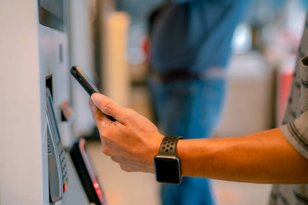 istock Paying with smart phone at department store. 1332148684