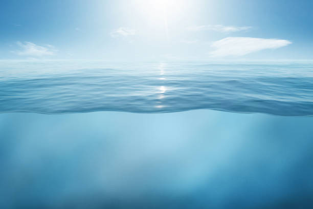 istock Blue sea or ocean water surface and underwater with sunny and cloudy sky 1332148898