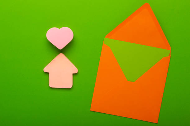 House figure from color paper with open envelope and empty space for a message