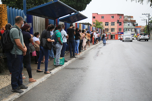 salvador, bahia, brasil - 22 de junho de 2021: Passengers are seen waiting for public transport at a bus stop in the Cabula neighborhood of the city of Salvador, due to a drivers strike.