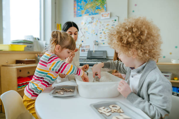 istock Learning play activities in kindergarten or daycare centre 1332150553