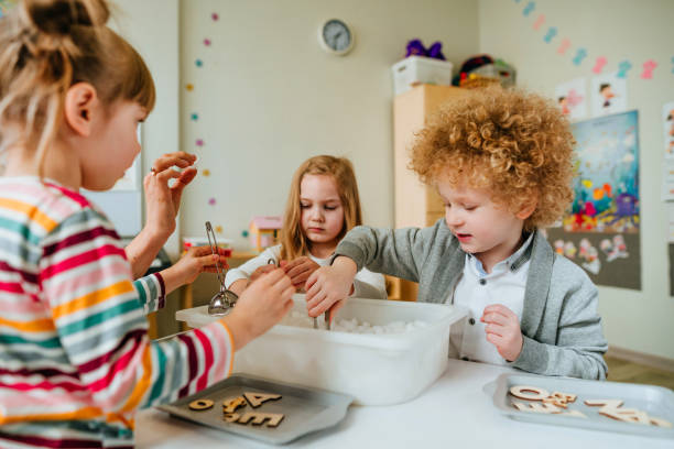istock Learning play activities in kindergarten or daycare centre 1332150569