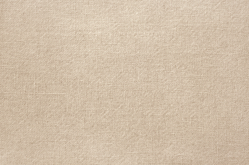 Fondo de textura de tela de algodón marrón, patrón sin costuras de textil natural. photo