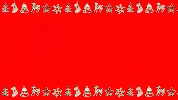Christmas greeting card mockup red background with wooden frame symbols of new year holidays, layout with copy space.