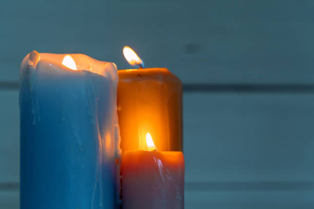 istock home lighting candles on wooden table 1332152069