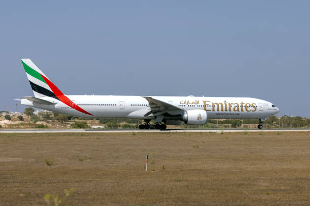 Boeing 777 on the runway prior take off Luqa, Malta - July 14, 2021: Emirates Boeing 777-31H (REG: A6-EPT) taxing for take off, restarted flights to Malta after COVID19 restriction were eased. ept stock pictures, royalty-free photos & images